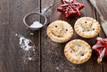 Christmas fruit mince pies over rustic wooden background