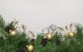 Christmas garland, Decoration, balls, fir tree and sugar-glaze cookies on white wooden background. Top view, copy space. Royalty Free Stock Photo