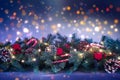 Christmas Garland with bright lights against a defocused dark night lights background. Royalty Free Stock Photo