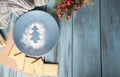 Christmas garland decoration placed on wooden planks.