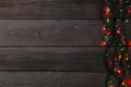 Christmas garland lights on grey background, copy space. Royalty Free Stock Photo