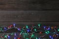 Christmas garland lights on grey background, copy space Royalty Free Stock Photo