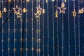 Christmas garlands and stars on a blue background