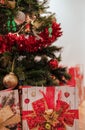 Christmas gift bags and the Christmas tree Royalty Free Stock Photo