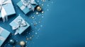 Christmas gift and blue ribbon, ball, decoration and snowflake group on a blue surface.