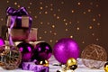 Christmas gift box and baubles on background of defocused golden Royalty Free Stock Photo