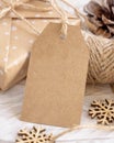 Christmas Gift Box with blank gift tag closeup, Mockup Royalty Free Stock Photo