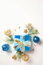 Christmas gift box with blue and gold balls and decorations isolated on white background Royalty Free Stock Photo