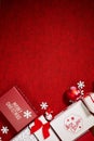Christmas gifts presents on red background. Simple, classic red and white wrapped gift boxes with ribbon Royalty Free Stock Photo