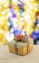 Christmas gift box with colourul bokeh background Royalty Free Stock Photo