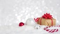Christmas gift box and decoration in snow against bokeh background Royalty Free Stock Photo