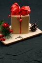 Christmas gift box, and decorations on dark concrete background Royalty Free Stock Photo