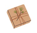 Christmas gift box design. Holiday present box with twine and winter fir branch decoration. Festive kraft brown package