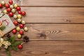 Christmas gift box, food decor and fir tree branch on wooden table. Top view with copy space Royalty Free Stock Photo