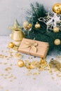 Christmas gift box with gold decorations. Royalty Free Stock Photo