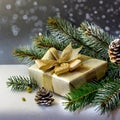 Christmas gift box with golden bow and fir tree branch on gray background Royalty Free Stock Photo