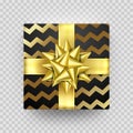 Christmas gift box New Year present in golden ribbon bow and wrapping paper wave foil gold pattern. Round gift box for Birthday or