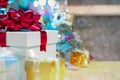 christmas gift box and red ribbon on christmas tree and abstract bokeh glitter background Royalty Free Stock Photo