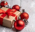 Christmas gift box with red ribbons on the snow background Royalty Free Stock Photo