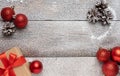 Christmas gift box with red ribbons on the snow background. Selective focus. Royalty Free Stock Photo