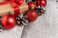 Christmas gift box with red ribbons on the snow background. Selective focus. Royalty Free Stock Photo