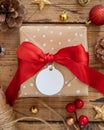 Christmas Gift Box with round blank gift tag top view Royalty Free Stock Photo