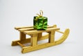 Christmas gift box on wooden sledges.