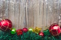 Christmas gift boxes and balls background on wooden texture Royalty Free Stock Photo