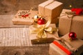 Christmas gift boxes collection with red decor on vintage wooden background. Classial preparation holiday. Copy space. Royalty Free Stock Photo