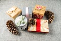 Christmas gift boxes on dark grey blanket background. Merry christmas greeting cards. Winter xmas holiday theme. Happy New Year