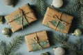 Christmas gift boxes, decoration and fir tree branch on blue background. Flat lay, top view Royalty Free Stock Photo