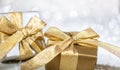 Christmas gift boxes with golden ribbons on abstract bokeh lights and glitter background Royalty Free Stock Photo