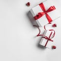 Christmas gift boxes with red ribbon and decoration on white background. Xmas and Happy New Year theme Royalty Free Stock Photo