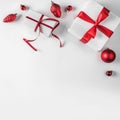 Christmas gift boxes with red ribbon and decoration on white background. Xmas and Happy New Year theme. Royalty Free Stock Photo
