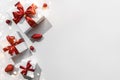 Christmas gift boxes with red ribbon and decoration on white background with bokeh, light. Xmas and Happy New Year holiday Royalty Free Stock Photo