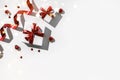 Christmas gift boxes with red ribbon and decoration on white background. Xmas and Happy New Year holiday, bokeh, light. Flat lay Royalty Free Stock Photo