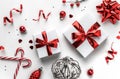 Christmas gift boxes with red ribbon and decoration on white background. Xmas and Happy New Year theme, snow. Flat lay, top view Royalty Free Stock Photo