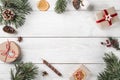 Christmas gift boxes on white wooden background with Fir branches, pine cones. Royalty Free Stock Photo