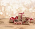 Christmas gift boxes on wooden table over abstract lights background Royalty Free Stock Photo