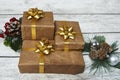 Christmas Gift boxes wrapped in craft paper on wooden background Royalty Free Stock Photo