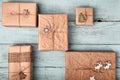 Christmas gift boxes wrapped in kraft paper on blue wooden table. Zero waste, eco friendly packaging Royalty Free Stock Photo