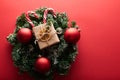 Christmas gift boxes wrapped kraft paper decorated ribbon bow and fir branches on marsala red background. Flat lay, top Royalty Free Stock Photo