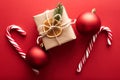 Christmas gift boxes wrapped kraft paper decorated ribbon bow and fir branches on marsala red background. Flat lay, top Royalty Free Stock Photo