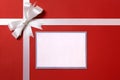 Christmas gift card or label and envelope, white ribbon bow, red