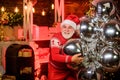 Christmas gift. Celebrate new year. December sale. Santa Claus delivering gift. Surprise concept. Man senior Santa claus