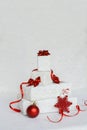 Christmas gift composition. White and red decorations on white background.