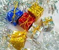 Christmas gift in foliage wrapping with festive decor. Royalty Free Stock Photo