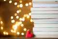 Christmas gift heart shape and pile of books