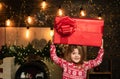 Christmas gift for kids - happiness concept. Happy Christmas little girl with a big Christmas present in her hands Royalty Free Stock Photo