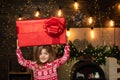 Christmas gift for kids - happiness concept. Happy Christmas little girl with a big Christmas present in her hands Royalty Free Stock Photo